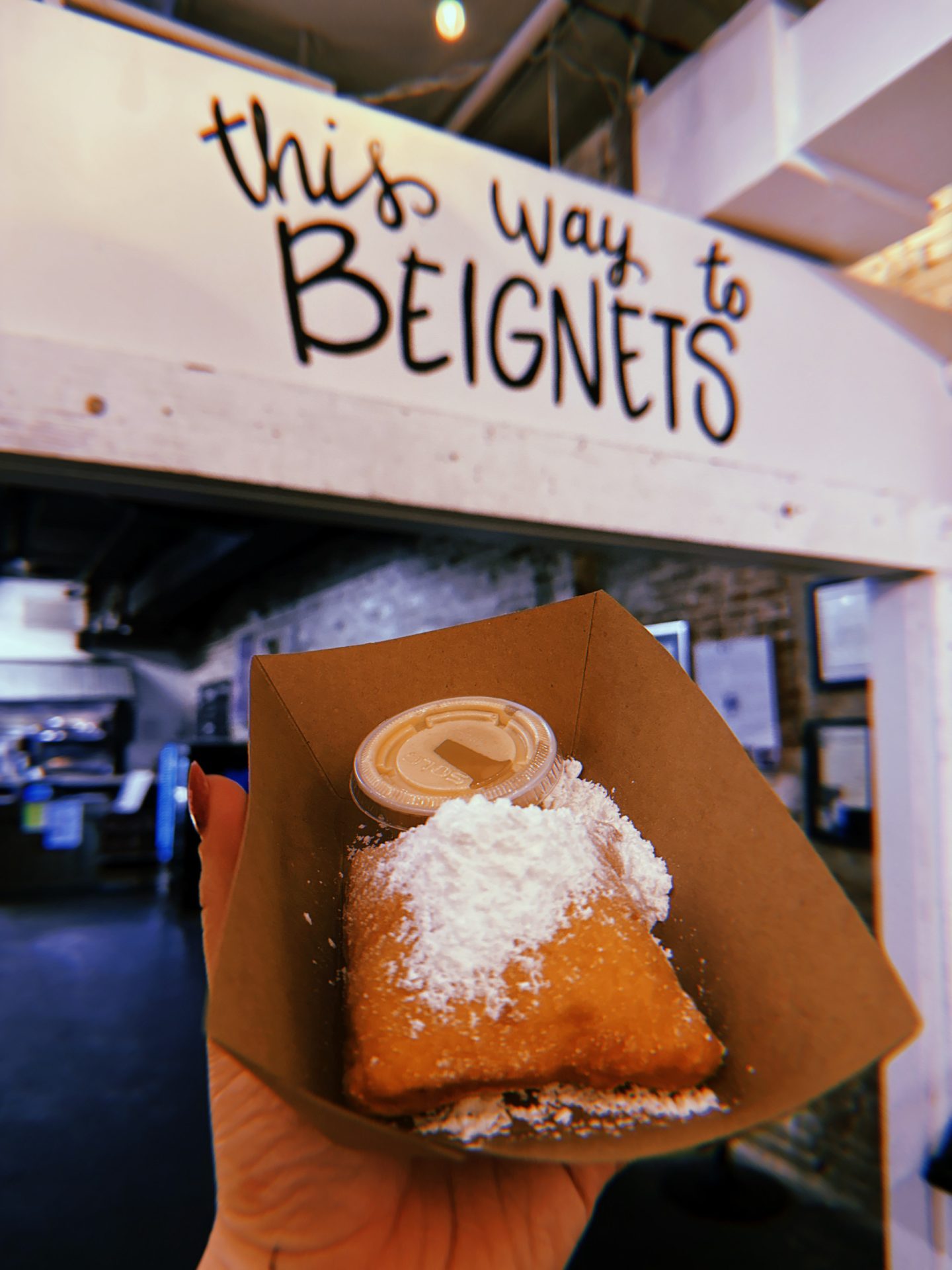 A beignet covered in sugar in Mobile Alabama.